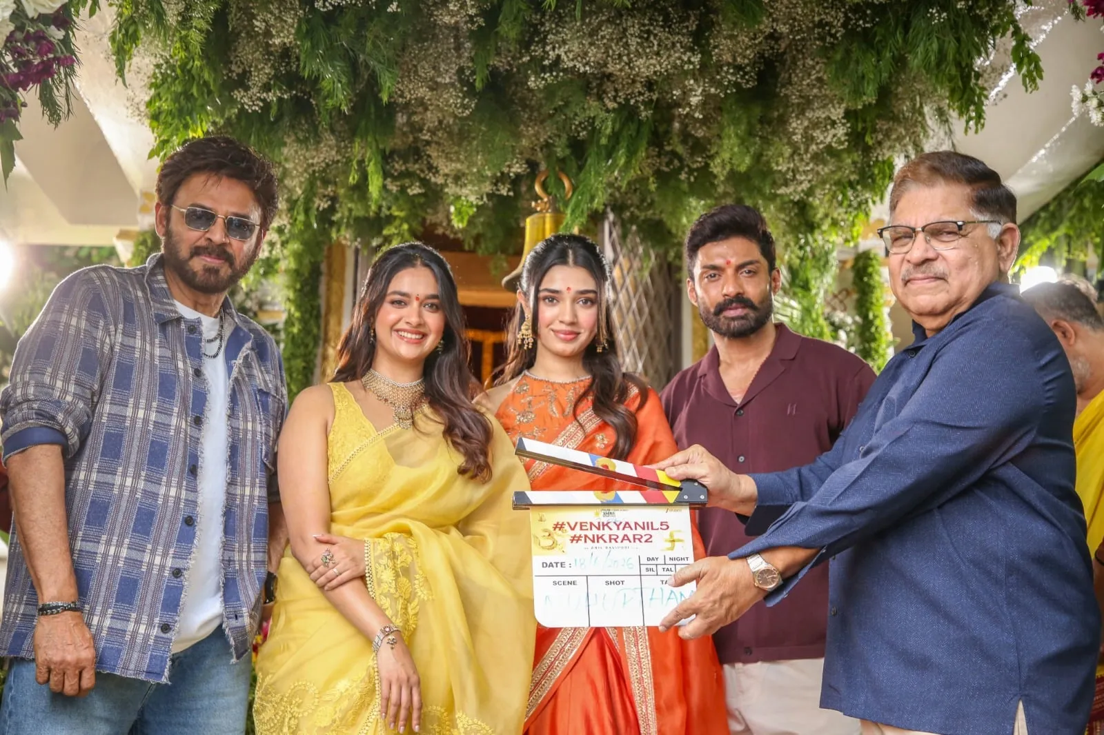 The script being handed over for the first shot at the muhurtham, with the lead cast looking on