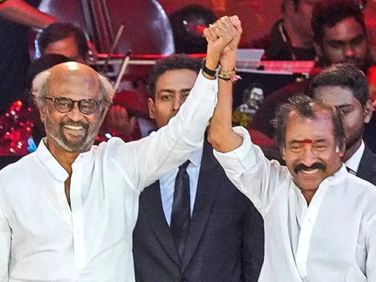 Rajinikanth and Deva raise their joined hands at the composer's 72nd-birthday concert in Chennai in November 2022.