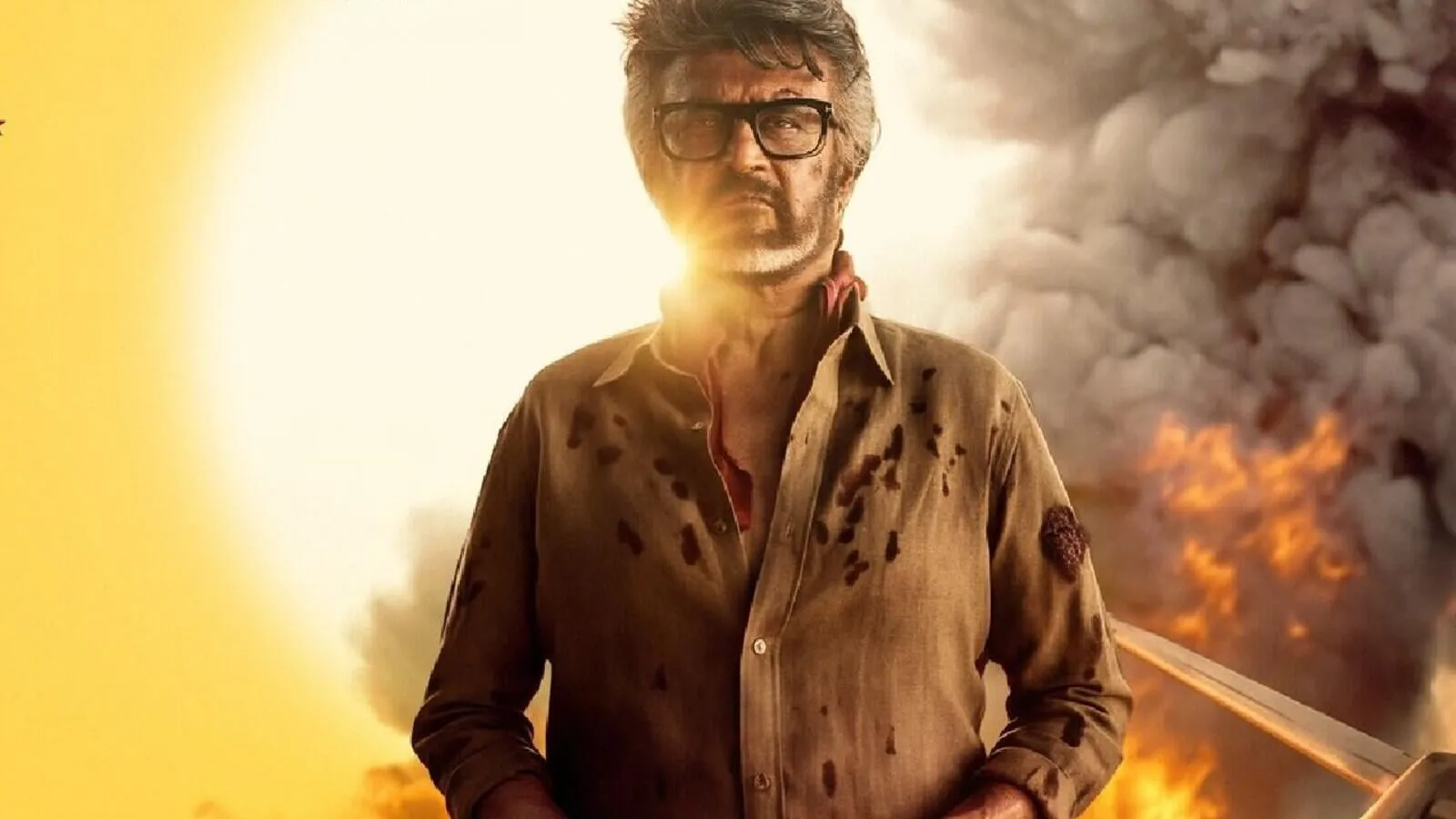 Rajinikanth as Tiger Muthuvel Pandian in a bloodstained shirt, with fire and smoke behind him in a Jailer 2 poster