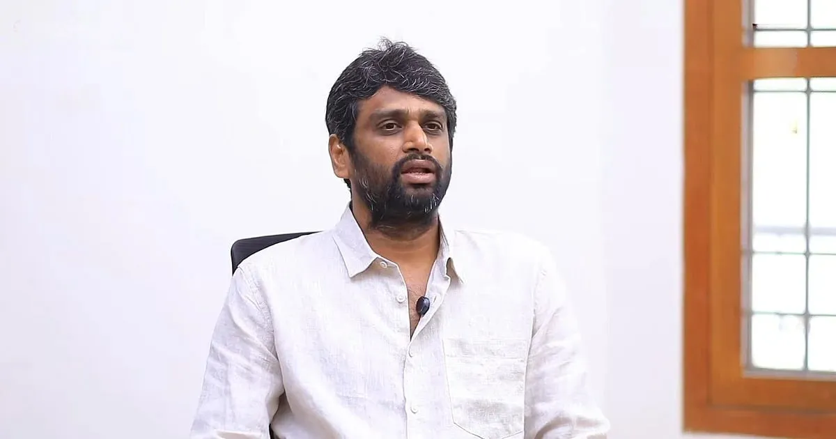 H Vinoth in a white shirt answering questions during an interview about Jana Nayagan