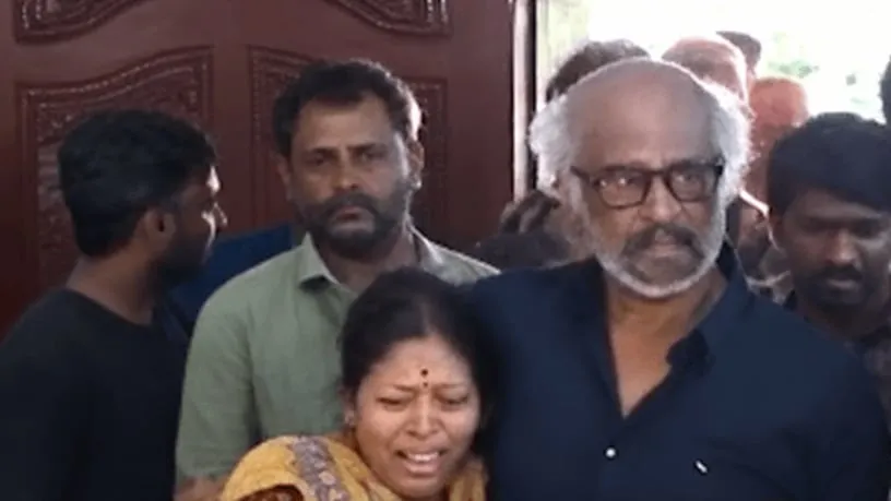 Rajinikanth with members of Deva's family while paying his respects in Chennai