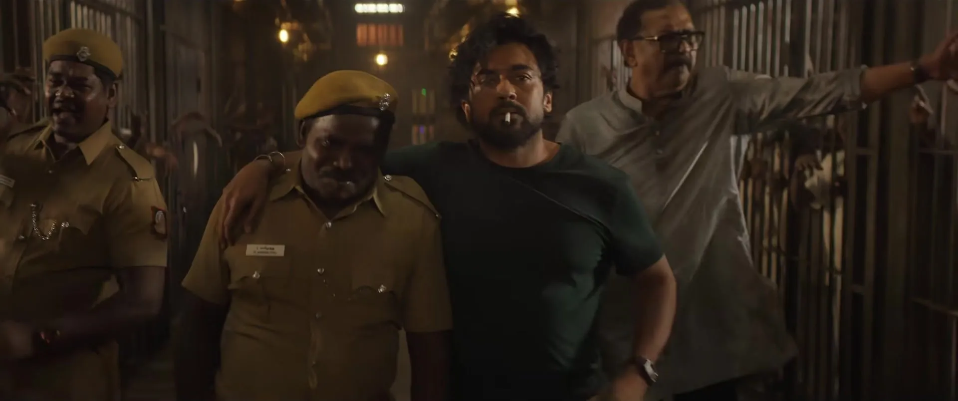 Policemen and prisoners in a jail corridor in the Scene teaser